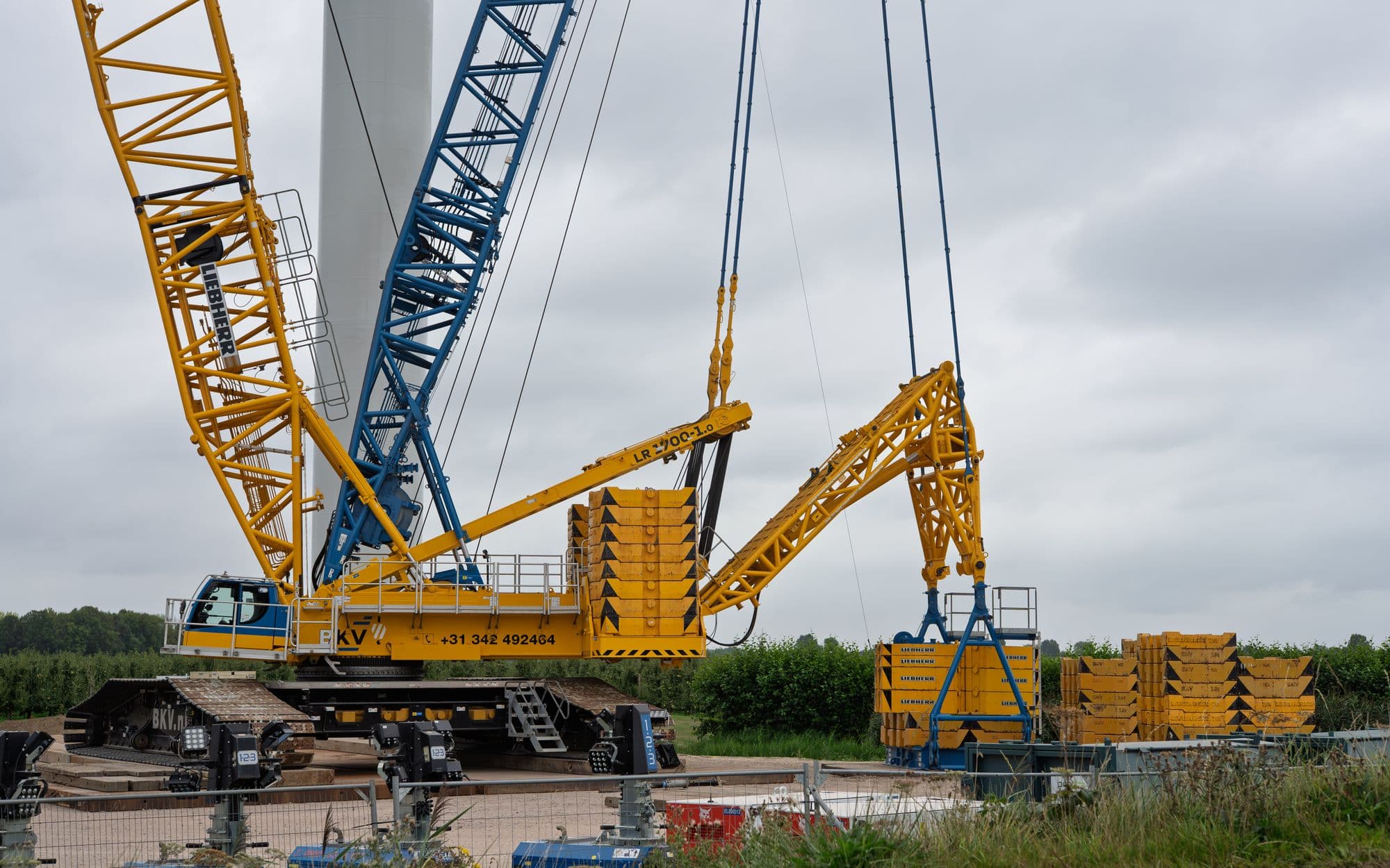 Liebherr LR crawler crane rigged with lattice boom and counterweights