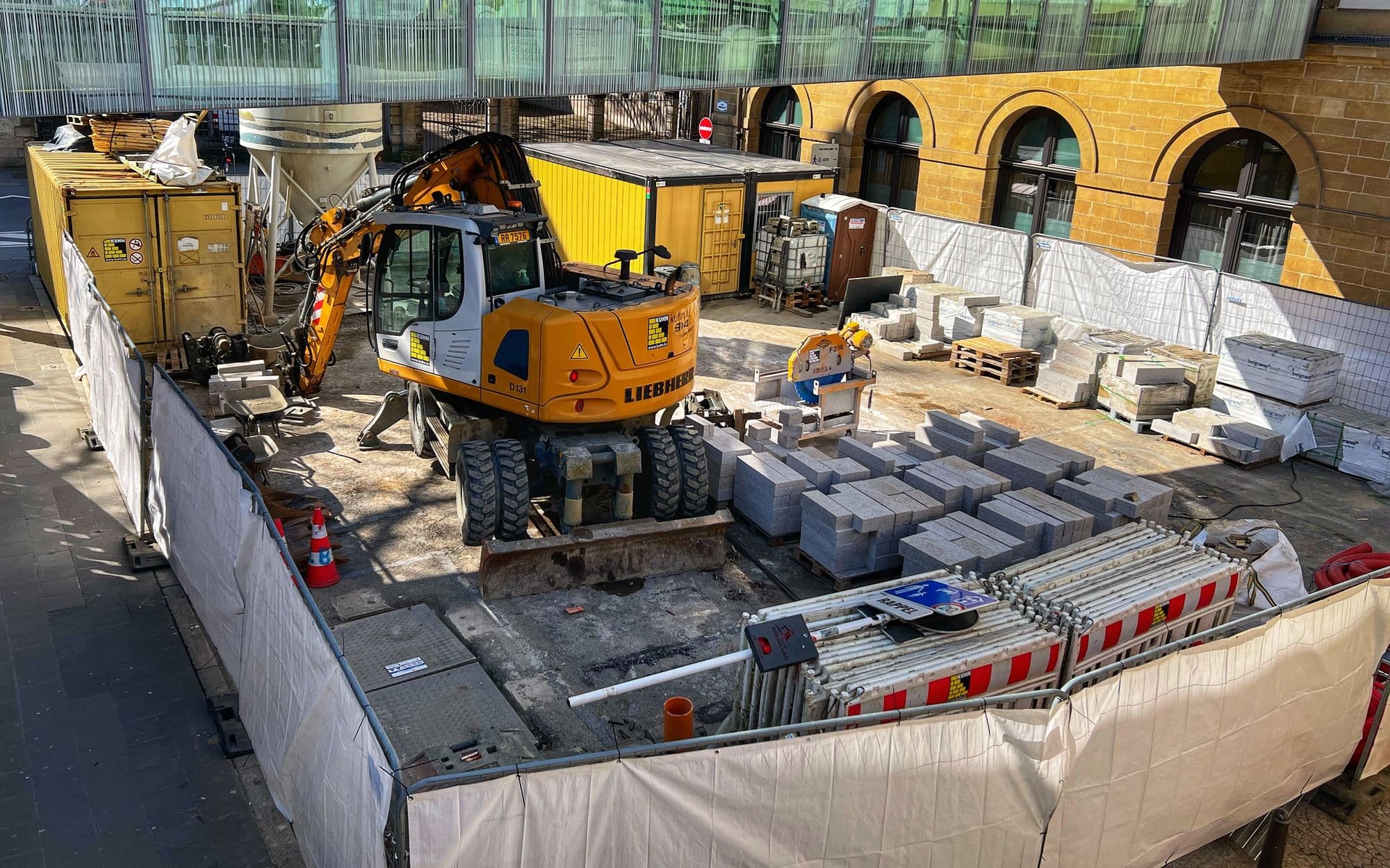 Liebherr wheeled excavator on a walled work site